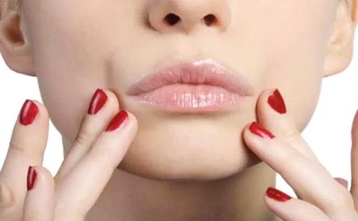 Before my periods, I get a dark line on the top of my upper lip. It looks like a moustache and fades only when my periods are over. Why is it so?