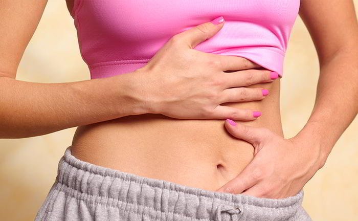 My friend suffers from PMS whereas I don't What is the reason?