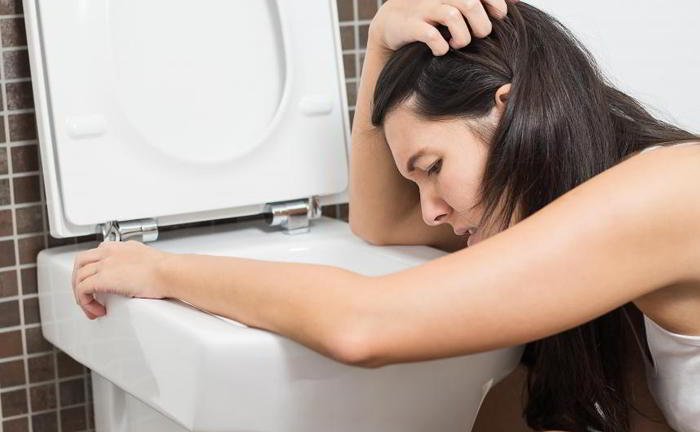 Sometime after drinking when I vomit, it is slightly brownish in color. Why is it so?